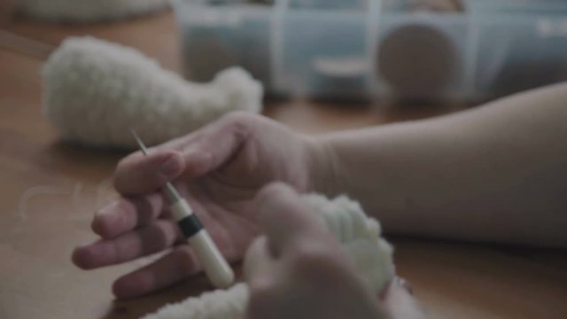 Teddy bear: the process of creation. Sewing a soft toy: a woman doing a teddy bear. Handmade. Details of teddy bear. A rare collectible toy is a teddy bear. Favorite toy of children is a teddy bear.