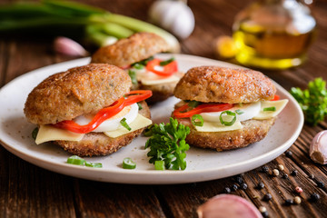 Fried patty filled with cheese, egg, bell pepper and scallion
