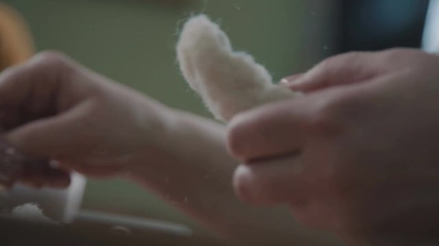 Teddy bear: the process of creation. Sewing a soft toy: a woman doing a teddy bear. Details and elements of a soft plush toy: female hands sew parts of a toy. Handmade.