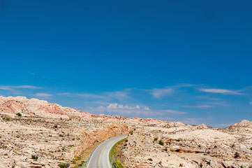 Desert Road winds through Monument Valley in Southwestern USA