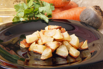 Baked potatoes for a vegetable salad. Ingredients for cooking healthy food from organic products