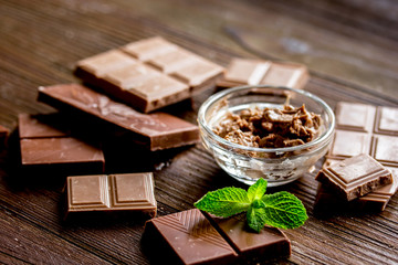black and milk chocolate bars dark wooden table background