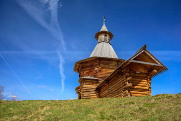 Spring view of the wooden Travel Tower of the Nikolo-Korelsky Monastery in the Kolomenskoye Museum at sunny day, Moscow, Russia