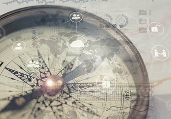 A compass and financial charts