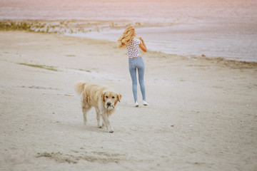 couple walking outdoors with her dog