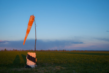 Windsock in sunset light and copy space