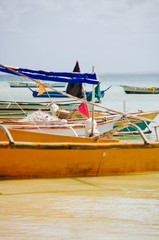 Local fishing boats in the water on the beach