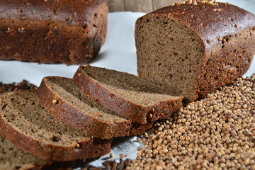 Sliced bread and seeds on textile close up