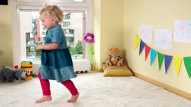 Hyperactive girl have fun. Active funny child at home