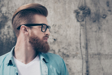 Profile portrait of stylish hot bearded nerdy in casual outfit outside. So harsh and virile