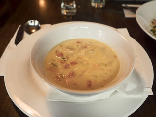 Fish creamy chowder in a plate served in a pub,.