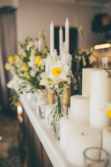 Flower and candles decoration in the restaurant interior