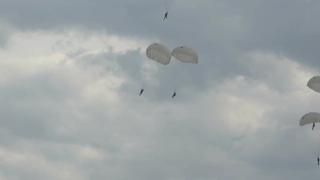 landing of parachutists in the sky.