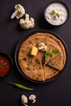 Stuffed Gobi Paratha or cauliflower paratha is a Indian flatbread. favourite breakfast or lunch menu in north India, served with curd and tomato ketchup