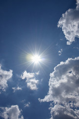 Naklejka na ściany i meble 輝く太陽と青空（紫外線、未来、可能性などのイメージ）、左上などにタイトルスペース