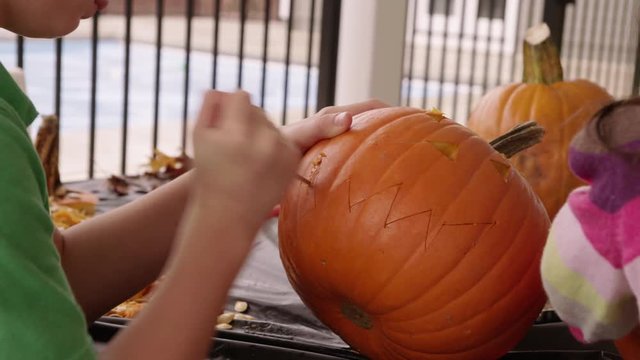 Carving jack o lantern pumpkin for Halloween