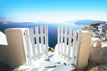 Open door in summer, vacation background. Oia village, Santorini, Greece, Europe location, famous...