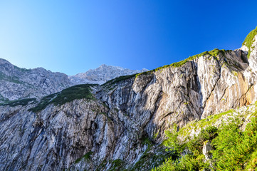 View up to Zugspitze (2962m above sea level), Germany's highest mountain, seen from Höllental, a beautiful valley hike to the summit of the mountain.