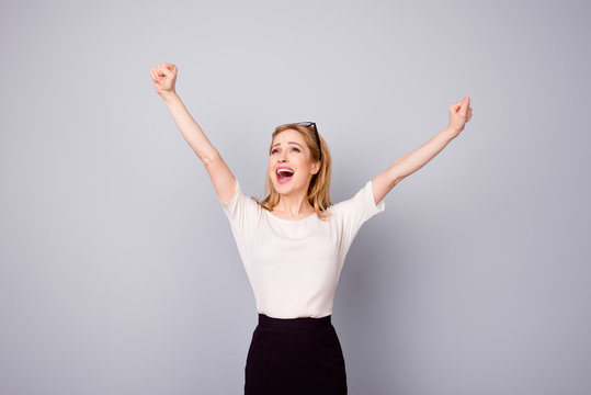 Yes! Pretty Extremely Happy Woman Celebrating Her Success With Raised Hands