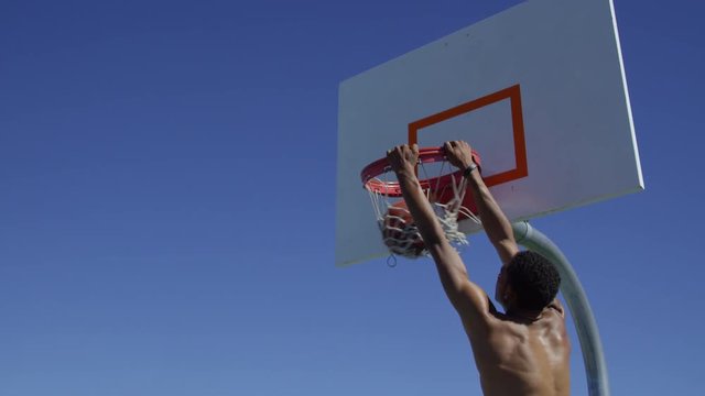 Slam dunk over defender in slow motion