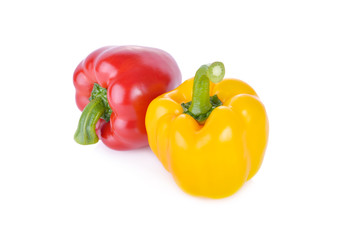 fresh red and yellow sweet pepper with stem on white background