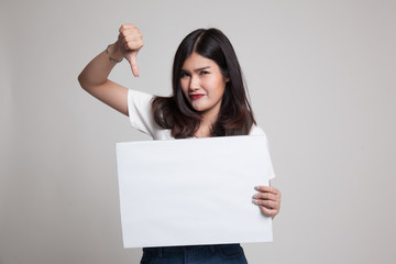 Fototapeta premium Young Asian woman show thumbs down with white blank sign.