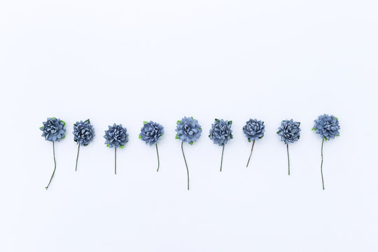 Fototapeta Blue paper flower on white background