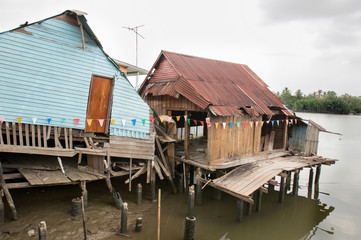Abandoned house on the waterfront in Chachoengsao Province of Thailand.
