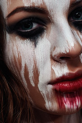 White painted Face of brunette Girl
