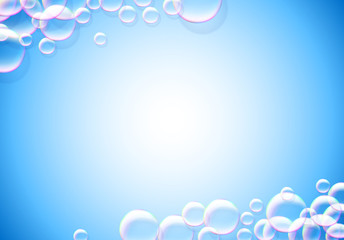 Soap bubbles abstract blue background with rainbow colored airy foam