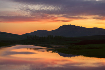 Fototapeta na wymiar Landscape with sunset colorful lake reflections in the foothills of Altai Mountains Siberia Russia