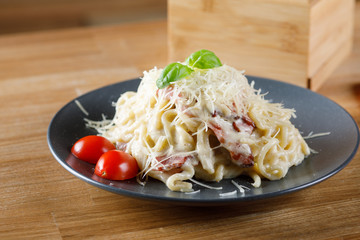 Delicious pasta with bacon and mushrooms