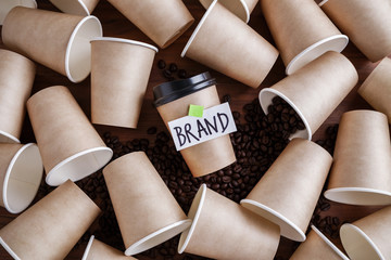 Coffee identity and brand building concept with lots of paper coffee cups background