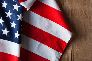 Fototapeta premium American flag close up on wood desk