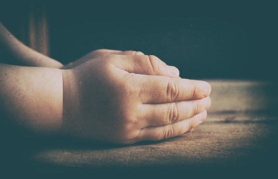 Child hands folded for prayer