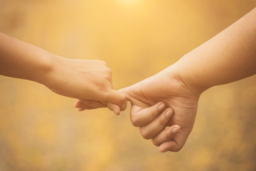 Closeup of loving couple holding hands