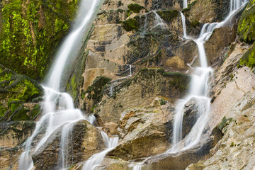 Fototapeta na wymiar Emerald Water of the Torre Torrent Falls. Silk water. Tarcento, Friuli to discover