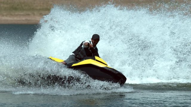 Man riding personal water craft on lake, super slow motion, shot on Phantom Flex 