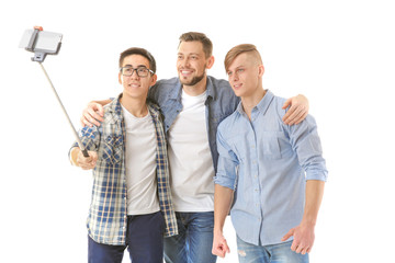 Handsome young men taking selfie on white background