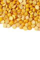 Dry yellow split peas isolated on white.