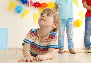Cute little children playing at birthday party