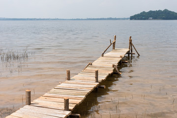 Fototapeta premium Summer time at the wooden pier in a lake