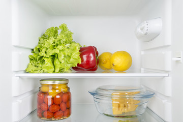Naklejka na ściany i meble Open fridge full of fresh fruits and vegetables