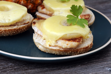 toast hawaii, , cheese and pineapple on wooden background with chicken breast