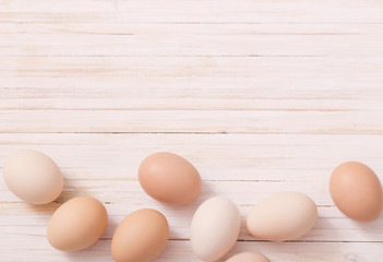 eggs on white wooden background