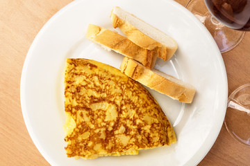 Spanish tortilla with wine, tapas in Madrid bar