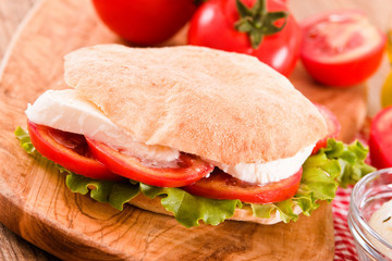 Puccia bread with mozzarella and tomato.