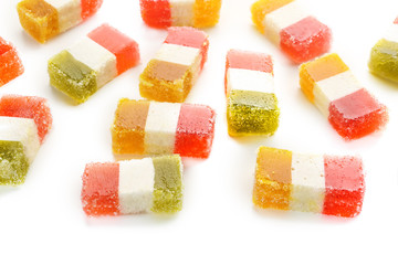 Tasty marmalade candies on white background