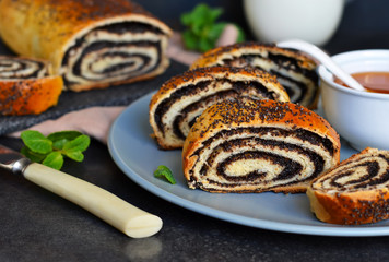 Homemade roll with poppy seeds and milk for breakfast