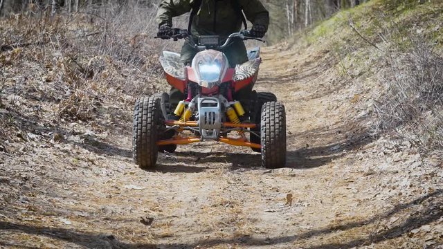 Scaffold. Off road terrain. The man on the ATV. The racer studies driving on off road terrain at the special car.